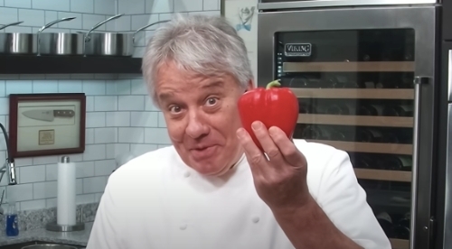 Screenshot of Chef Jean-Pierre Bréhier holding a red pepper