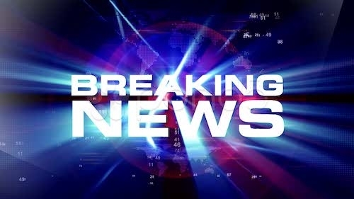 typical TV news show graphic with white BREAKING NEWS text and blue laser light show style background