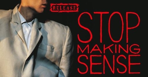 Promo photo: against a dark background, partial head and torso of David Byrne in the big suit on the left, and on the right, in red, the word Release in a box, and larger text Stop Making Sense, stacked