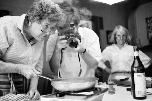 black and white photo of Julia Child on the set of her TV show