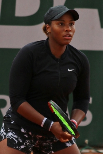Taylor Townsend on court with tennis racket