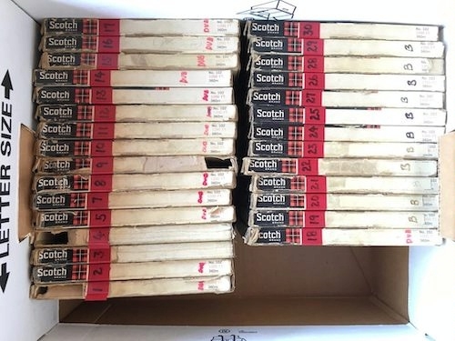 photo of a file box of old, numbered audiotapes in their Scotch brand sleeves