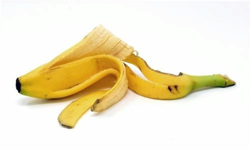 image of a yellow banana peel against a white background