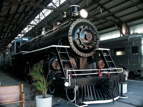 Photo of an antique black steam locomotive, Florida East Coast Railway No. 153 at the Gold Coast Railroad Museum