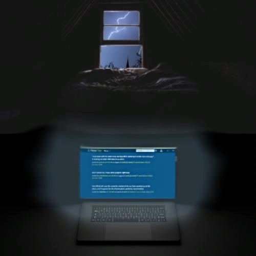 a dark room with a window in the background, through which a lightning storm is visible. The lightning illuminates the sky, highlighting the outlines of some objects, possibly rooftops, or trees. In the foreground, there's a laptop screen emitting a soft glow in the otherwise dark room. The screen displays white text on a webpage with a dark blue background. The overall atmosphere of the image is moody and tense, with the contrast between the storm outside and the laptop's glow creating a sense of isolation or focus.