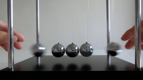 screen shot of Newton pendulum from the video