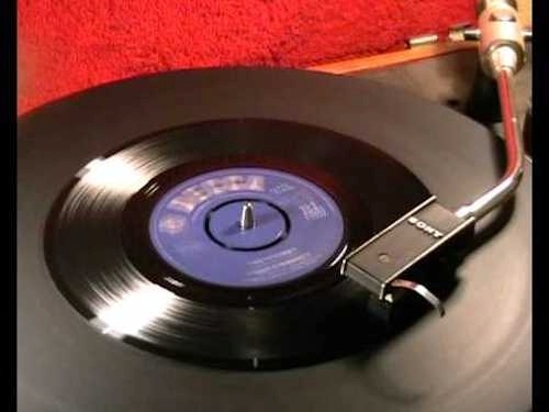 45 record playing on old fashioned record player