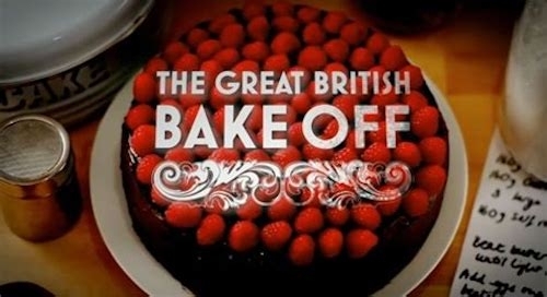 The Great British Bake Off promo photo of a chocolate iced cake with strawberries on top overprinted with the logo for the show 